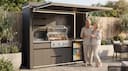 Compact outdoor kitchen — Couple celebrating